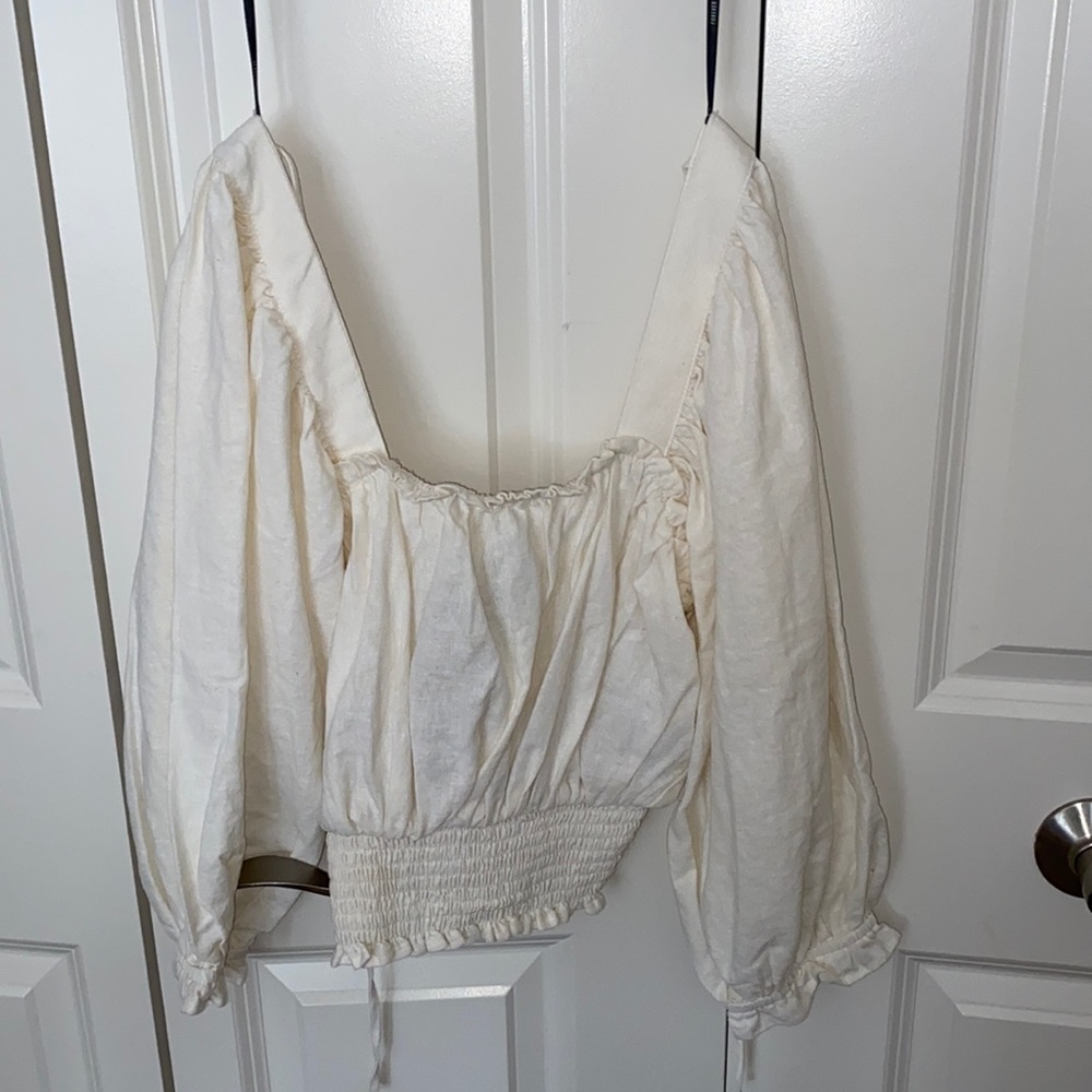 beige top never worn